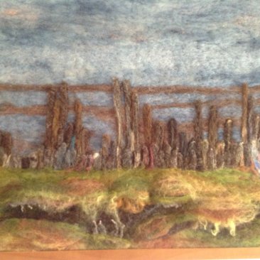 Schilderij van een strand, gemaakt met wol