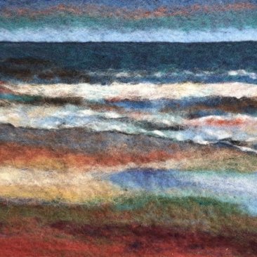 Schilderij van een strand, gemaakt met wol
